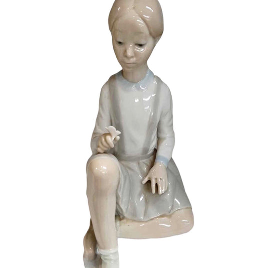 Vintage “Girl Sitting With Flower” Figurine by Lladro